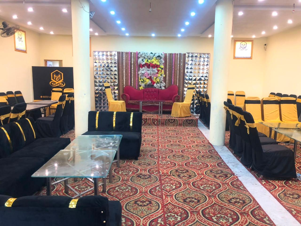 Master Event Hall first floor — lounge seating with decorated stage